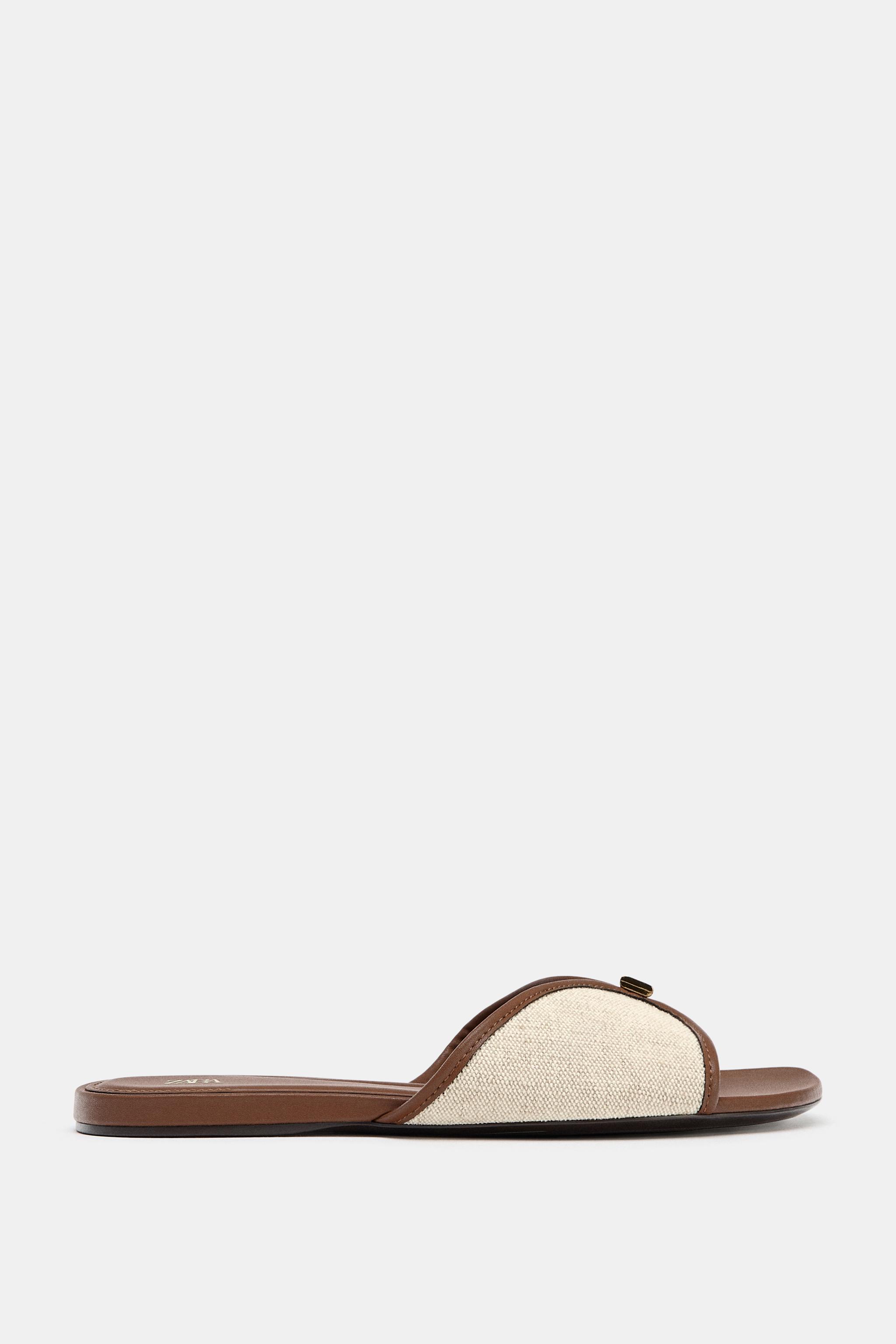 FLAT SANDALS WITH METAL DETAIL